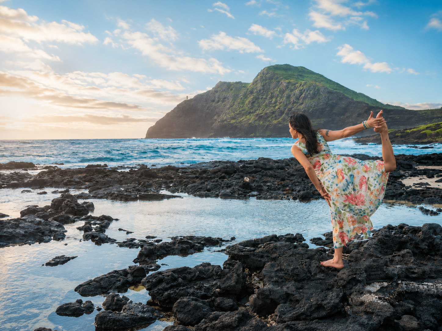Co-founder Marie Benoit seated in stillness on a teak deck facing the Pacific, Hawaiʻi